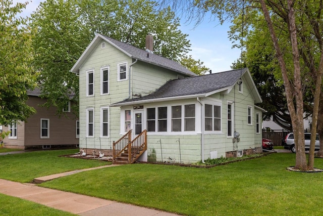 805 N State St, Appleton, WI 54911 - view of front of home with a shingled roof, a front yard, and entry steps