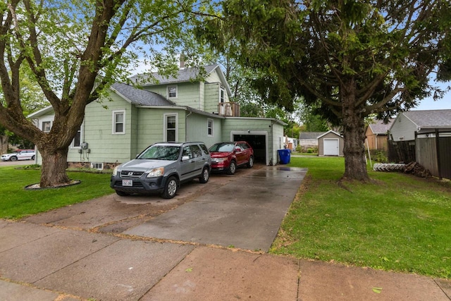 805 N State St, Appleton, WI 54911 - view of side of home with a lawn, concrete driveway, and an attached garage