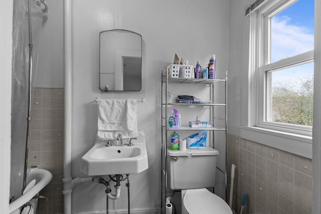 805 N State St, Appleton, WI 54911 - bathroom featuring tile walls, a sink, and toilet