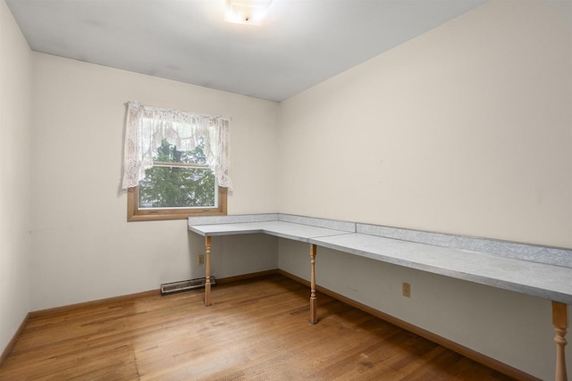 1054 Oxford Ct, Neenah, WI 54956 - unfurnished office with built in desk, light wood-type flooring, and baseboards