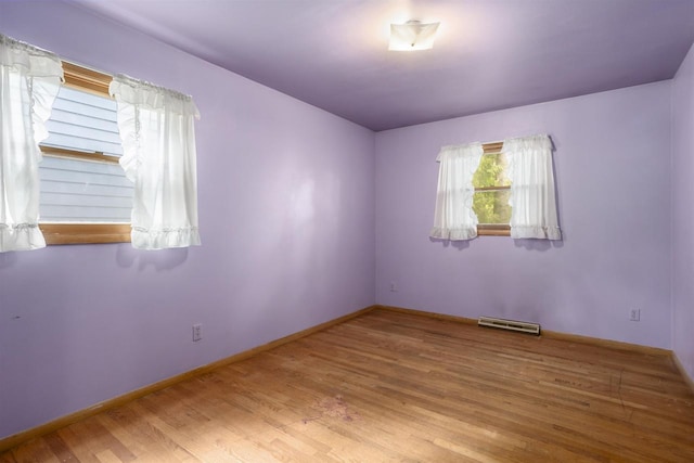1054 Oxford Ct, Neenah, WI 54956 - spare room featuring wood finished floors and baseboards