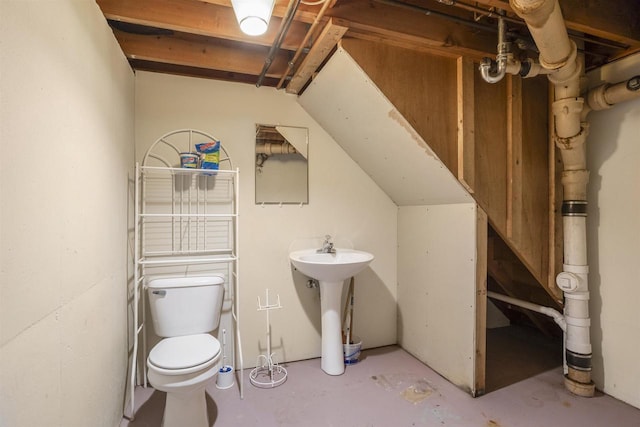 1054 Oxford Ct, Neenah, WI 54956 - bathroom featuring toilet, concrete flooring, and a sink