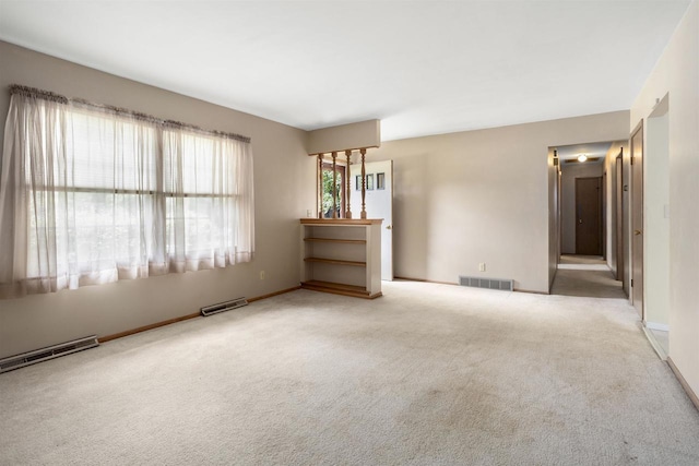 1054 Oxford Ct, Neenah, WI 54956 - carpeted empty room with baseboards and baseboard heating