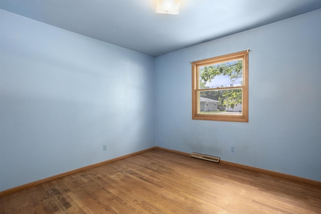1054 Oxford Ct, Neenah, WI 54956 - empty room featuring wood finished floors and baseboards