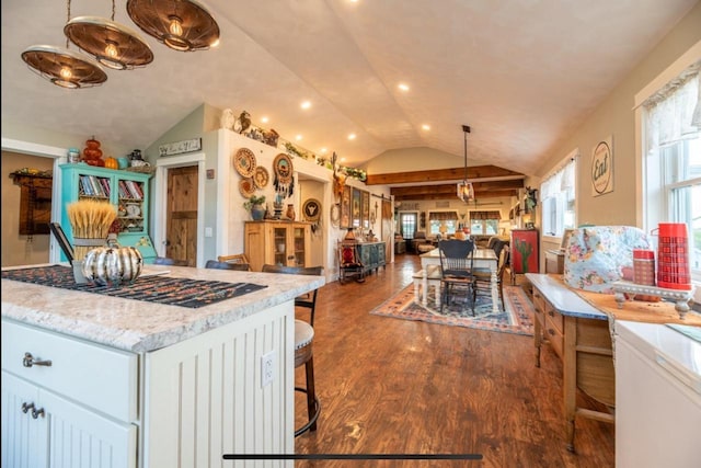 76 Hillside Rd, Edgerton, WI 53534 - kitchen featuring lofted ceiling, open floor plan, dark wood finished floors, recessed lighting, and hanging light fixtures