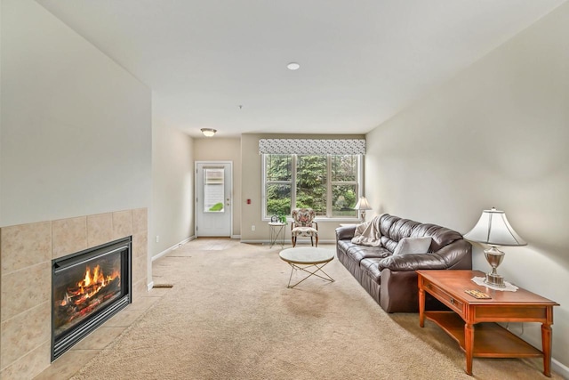 8687 S Deerwood Ln, Franklin, WI 53132 - living room featuring a tile fireplace, baseboards, and light colored carpet