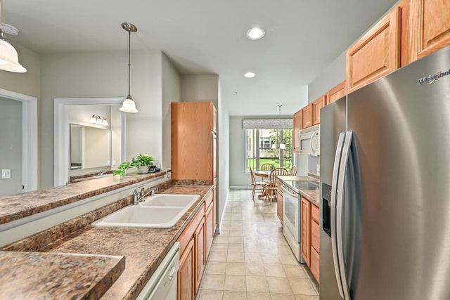 8687 S Deerwood Ln, Franklin, WI 53132 - kitchen with white appliances, a sink, light tile patterned flooring, hanging light fixtures, and recessed lighting