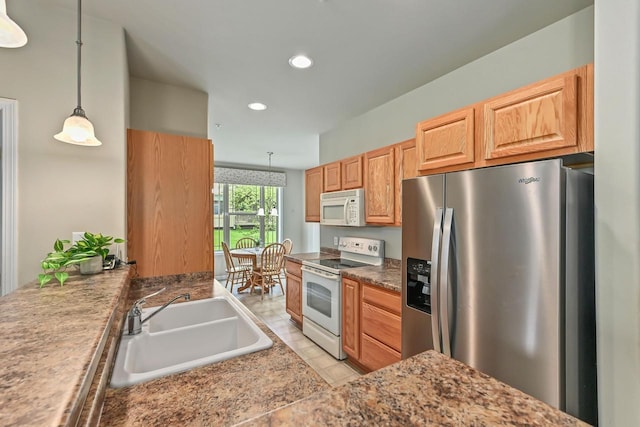 8687 S Deerwood Ln, Franklin, WI 53132 - kitchen featuring white appliances, a sink, recessed lighting, and decorative light fixtures