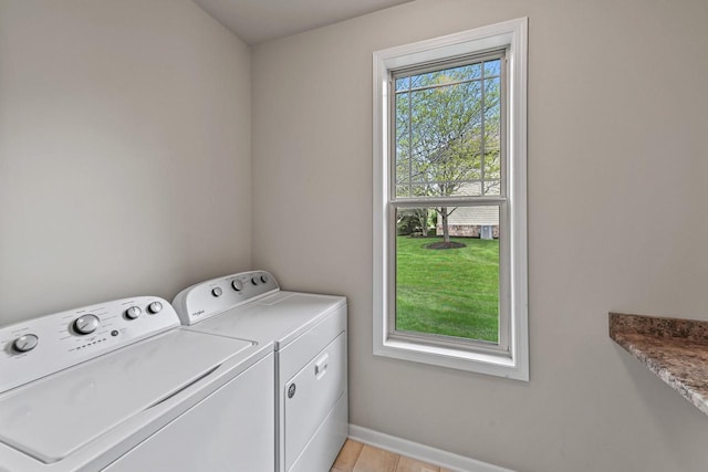 8687 S Deerwood Ln, Franklin, WI 53132 - laundry room with separate washer and dryer, baseboards, and light tile patterned flooring