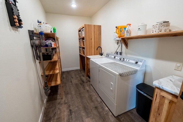 S1579 Butler Rd, Hillsboro, WI 54634 - washroom with separate washer and dryer, dark wood-type flooring, cabinet space, and baseboards