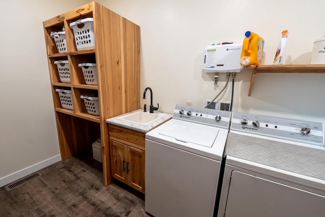S1579 Butler Rd, Hillsboro, WI 54634 - washroom featuring cabinet space, separate washer and dryer, dark wood finished floors, and baseboards