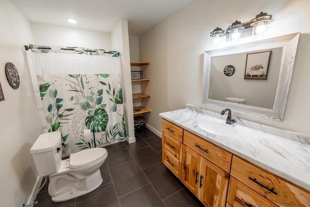 S1579 Butler Rd, Hillsboro, WI 54634 - bathroom featuring toilet, vanity, tile patterned floors, and baseboards
