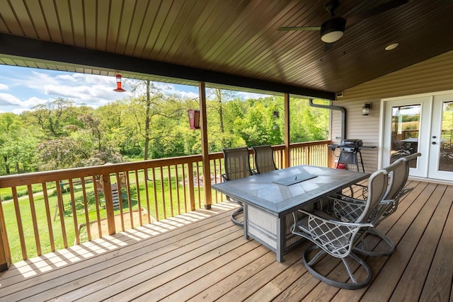 S1579 Butler Rd, Hillsboro, WI 54634 - deck featuring a yard, a ceiling fan, outdoor dining area, and view of scattered trees
