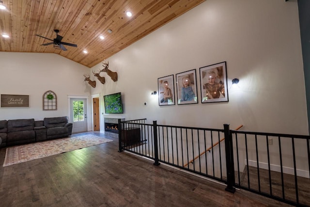 S1579 Butler Rd, Hillsboro, WI 54634 - living area featuring wooden ceiling, recessed lighting, a ceiling fan, wood finished floors, and a warm lit fireplace