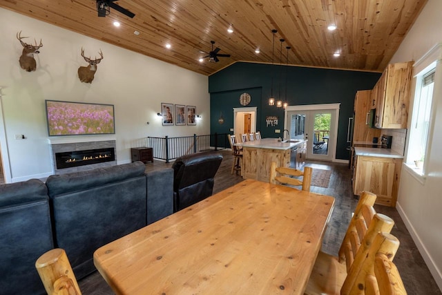 S1579 Butler Rd, Hillsboro, WI 54634 - dining space featuring wooden ceiling, a ceiling fan, baseboards, a glass covered fireplace, and recessed lighting