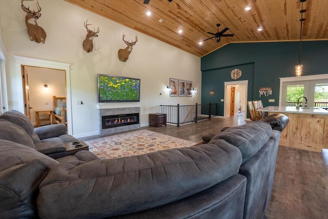 S1579 Butler Rd, Hillsboro, WI 54634 - living area with wooden ceiling, ceiling fan, dark wood finished floors, high vaulted ceiling, and a glass covered fireplace