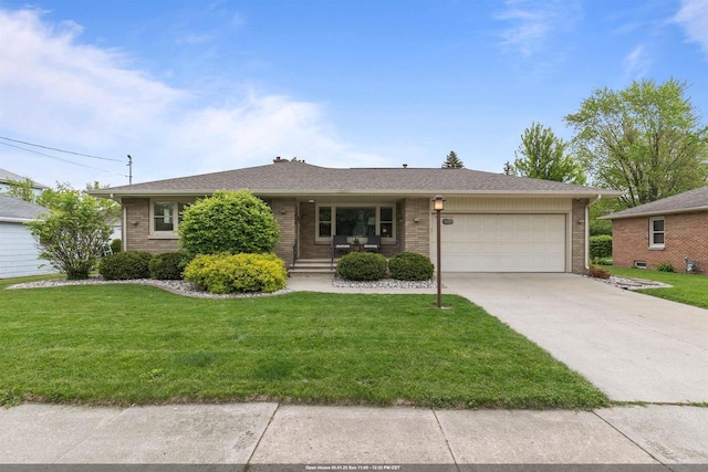 751 Warsaw St, Menasha, WI 54952 - ranch-style house featuring a garage, brick siding, driveway, and a front yard