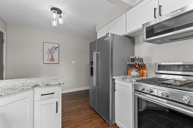 751 Warsaw St, Menasha, WI 54952 - kitchen featuring stainless steel appliances, white cabinets, and baseboards