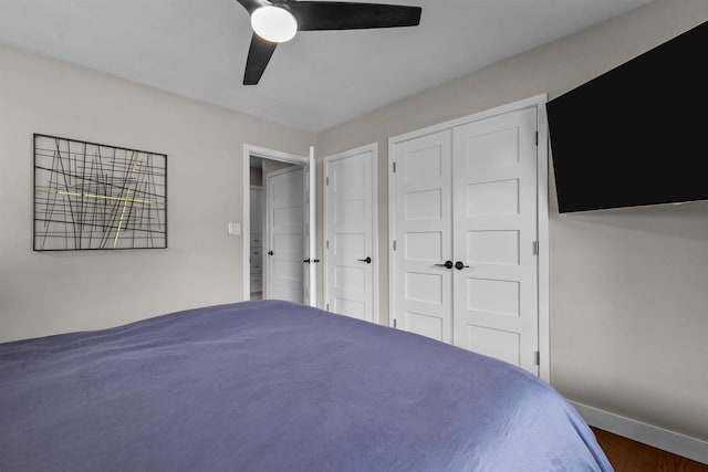 751 Warsaw St, Menasha, WI 54952 - bedroom featuring baseboards, a ceiling fan, and a closet