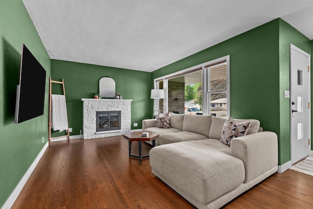 751 Warsaw St, Menasha, WI 54952 - living area featuring baseboards, wood finished floors, and a stone fireplace