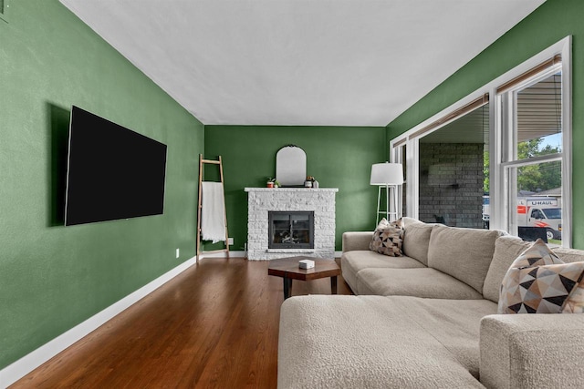 751 Warsaw St, Menasha, WI 54952 - living area featuring dark wood finished floors, baseboards, and a glass covered fireplace