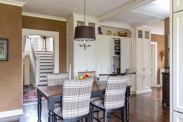 1030 Washington Ave, Oshkosh, WI 54901 - dining area featuring dark wood-type flooring, stairway, ornamental molding, wallpapered walls, and baseboards