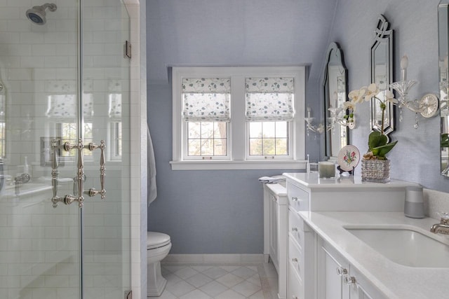 1030 Washington Ave, Oshkosh, WI 54901 - bathroom featuring a stall shower, vanity, toilet, and tile patterned flooring