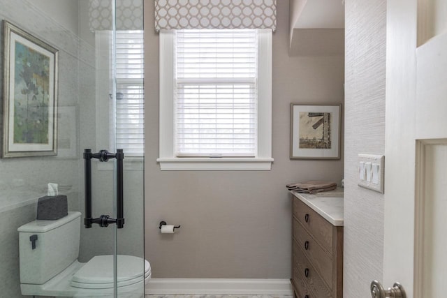 1030 Washington Ave, Oshkosh, WI 54901 - bathroom with toilet, vanity, healthy amount of natural light, and baseboards