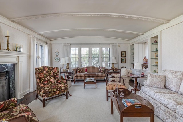 1030 Washington Ave, Oshkosh, WI 54901 - living area with a fireplace, built in shelves, and vaulted ceiling