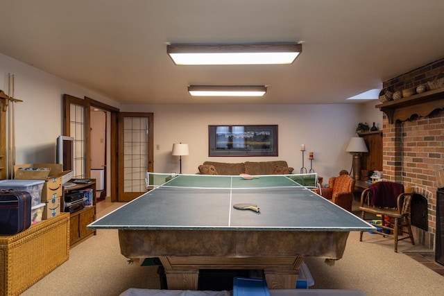 1030 Washington Ave, Oshkosh, WI 54901 - rec room with light carpet and a brick fireplace