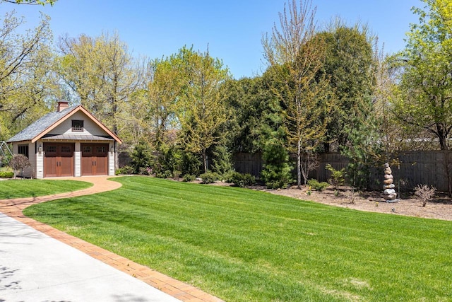 1030 Washington Ave, Oshkosh, WI 54901 - view of yard featuring a detached garage and an outdoor structure