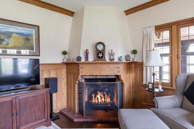 1030 Washington Ave, Oshkosh, WI 54901 - living area with crown molding, a brick fireplace, and wood finished floors