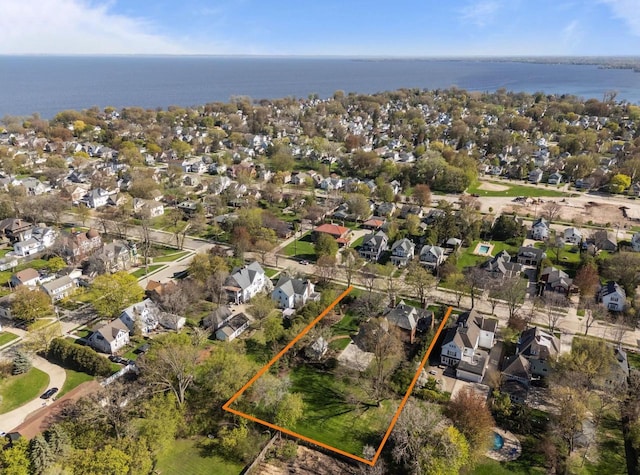 1030 Washington Ave, Oshkosh, WI 54901 - aerial view of residential area with property parcel outlined and a nearby body of water