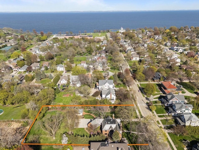 1030 Washington Ave, Oshkosh, WI 54901 - aerial view of residential area with property parcel outlined and a large body of water