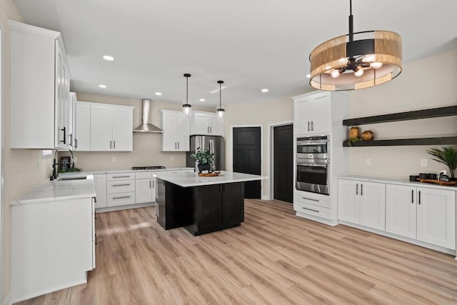 11715 45th Ave, Pleasant Prairie, WI 53158 - kitchen with wall chimney exhaust hood, stainless steel appliances, light wood-type flooring, a sink, and recessed lighting