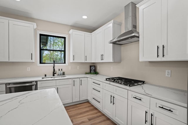 11715 45th Ave, Pleasant Prairie, WI 53158 - kitchen with wall chimney range hood, a sink, stainless steel appliances, white cabinets, and light wood finished floors