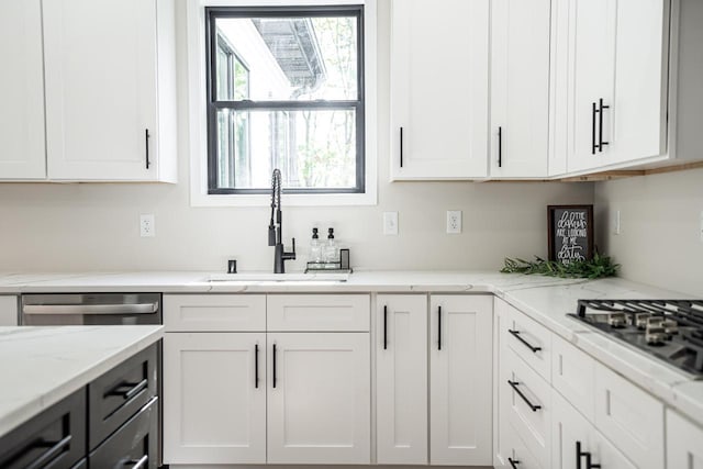 11715 45th Ave, Pleasant Prairie, WI 53158 - kitchen featuring a sink, stainless steel gas cooktop, white cabinets, and light stone countertops