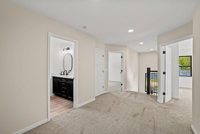 11715 45th Ave, Pleasant Prairie, WI 53158 - spare room with light colored carpet, baseboards, recessed lighting, and a sink