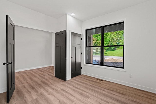 11715 45th Ave, Pleasant Prairie, WI 53158 - unfurnished bedroom featuring light wood-style flooring, baseboards, and recessed lighting