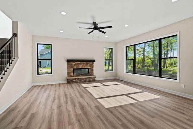 11715 45th Ave, Pleasant Prairie, WI 53158 - unfurnished living room with stairway, baseboards, wood finished floors, ceiling fan, and recessed lighting
