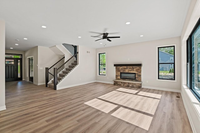 11715 45th Ave, Pleasant Prairie, WI 53158 - unfurnished living room with light wood-style floors, baseboards, stairs, and recessed lighting