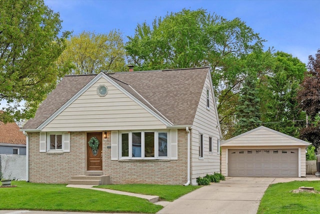 8706 W Arthur Ave, West Allis, WI 53227 - view of front of home featuring brick siding, a detached garage, an outbuilding, and roof with shingles