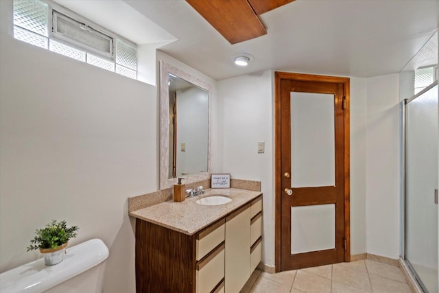 8706 W Arthur Ave, West Allis, WI 53227 - full bath with vanity, toilet, a stall shower, and tile patterned flooring
