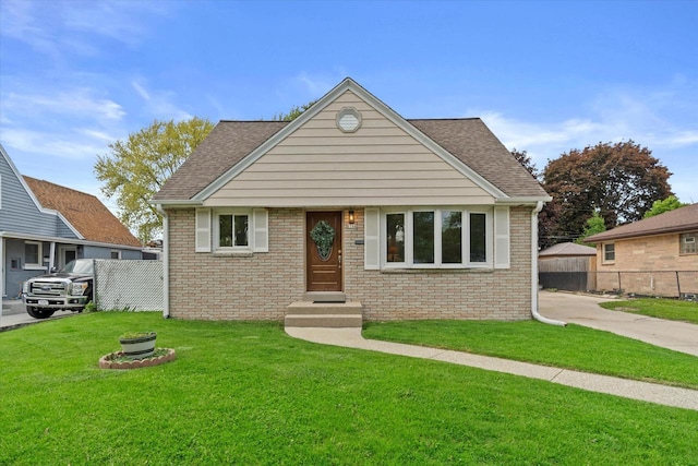 8706 W Arthur Ave, West Allis, WI 53227 - view of front facade with brick siding and a shingled roof