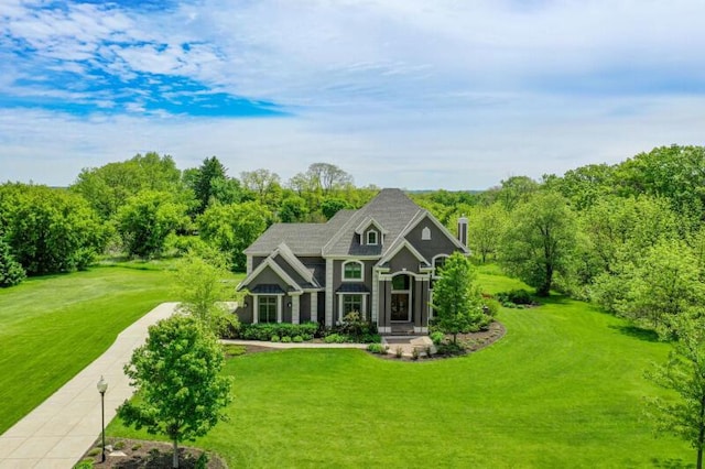W292S5474 Fox Run Ct, Waukesha, WI 53189 - view of front of home with a front lawn and a chimney