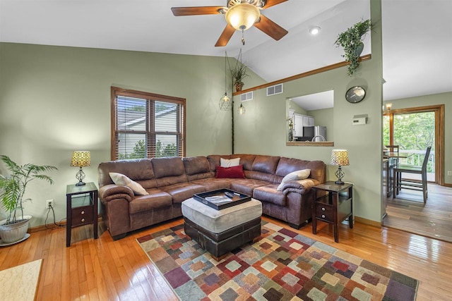 812 Clover Ln, Deforest, WI 53532 - living room with ceiling fan, vaulted ceiling, hardwood / wood-style flooring, healthy amount of natural light, and baseboards