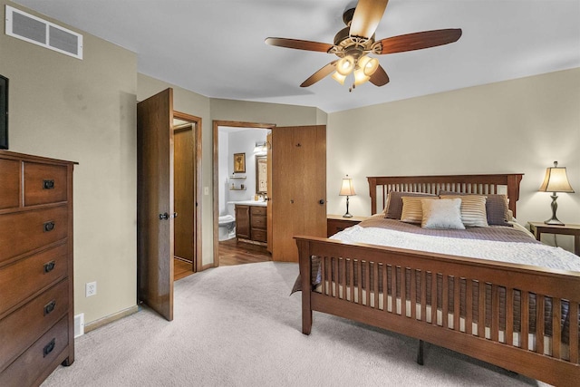 812 Clover Ln, Deforest, WI 53532 - bedroom featuring light colored carpet, ensuite bath, and baseboards