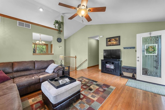812 Clover Ln, Deforest, WI 53532 - living room with lofted ceiling, hardwood / wood-style flooring, ceiling fan, and a chandelier