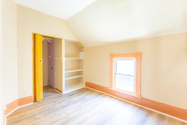 1031 S 15th St, Milwaukee, WI 53204 - unfurnished room featuring vaulted ceiling, wood finished floors, and baseboards