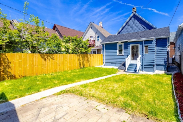 1031 S 15th St, Milwaukee, WI 53204 - view of front facade featuring entry steps and roof with shingles